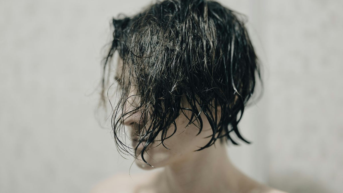 topless woman with black hair